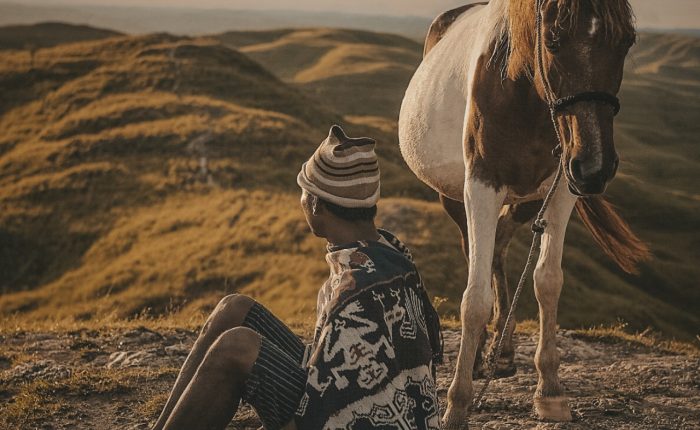Sumbanese people with a horse in a hill